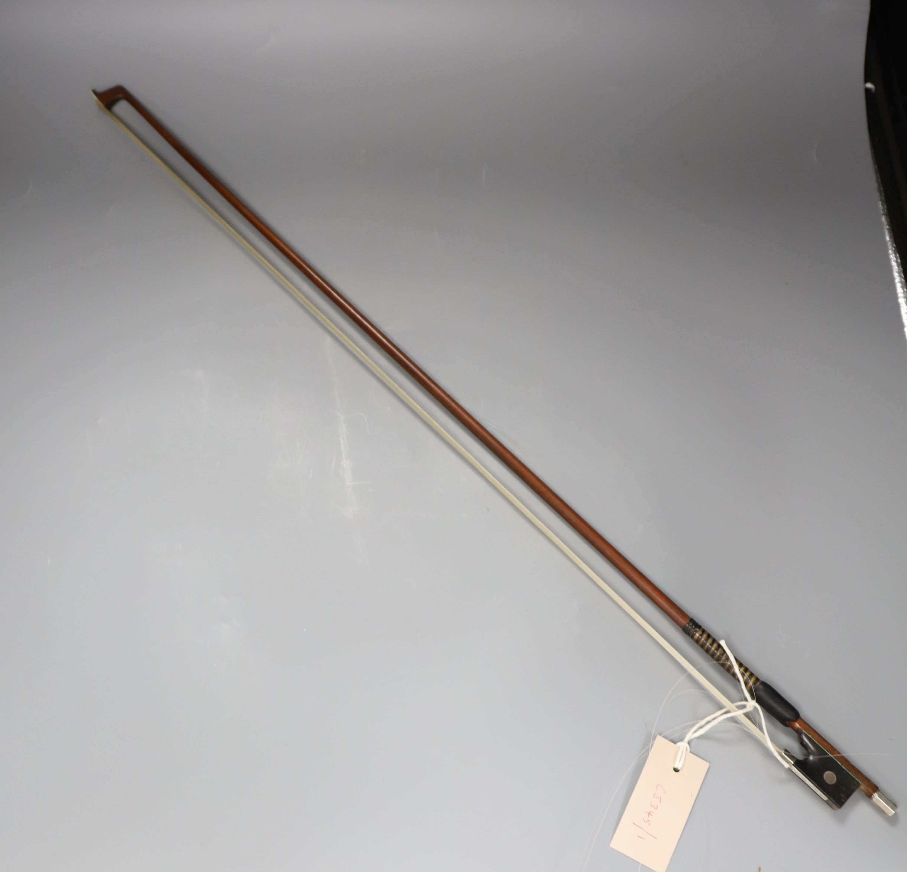 A 19th century German silver-mounted violin bow with original lapping